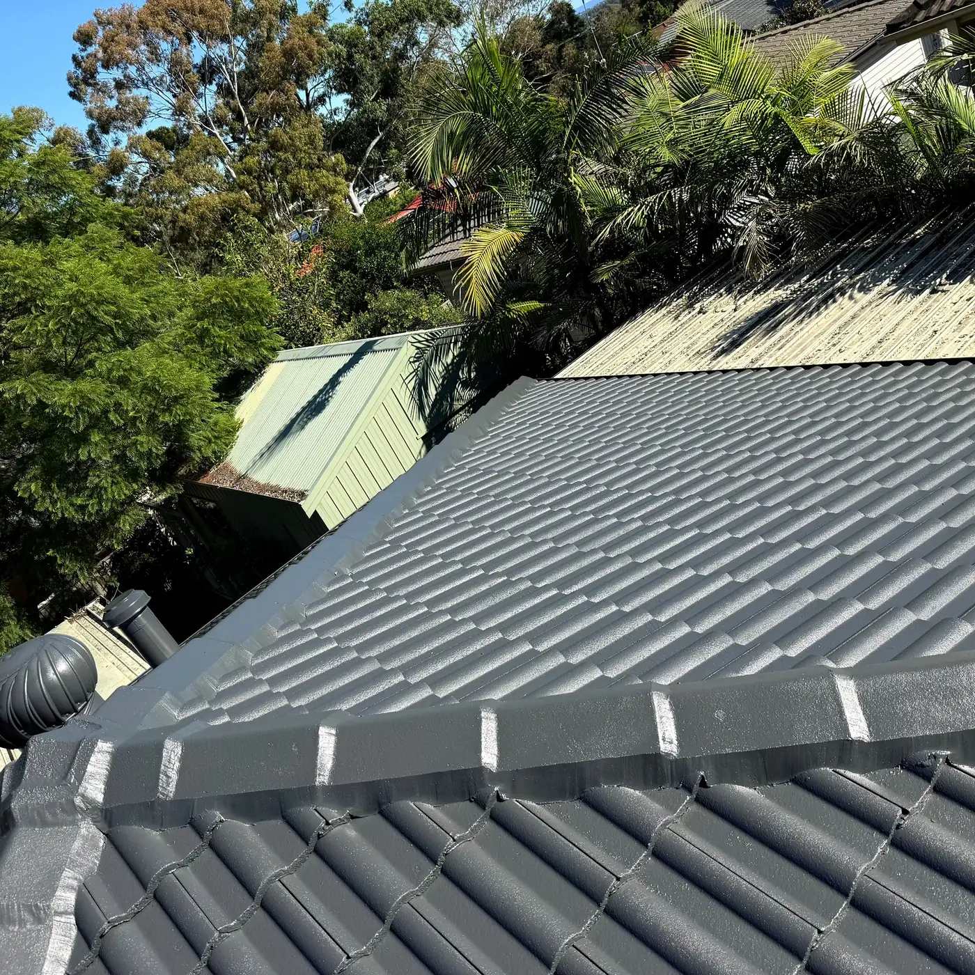 Dark metal roofing after roofing work